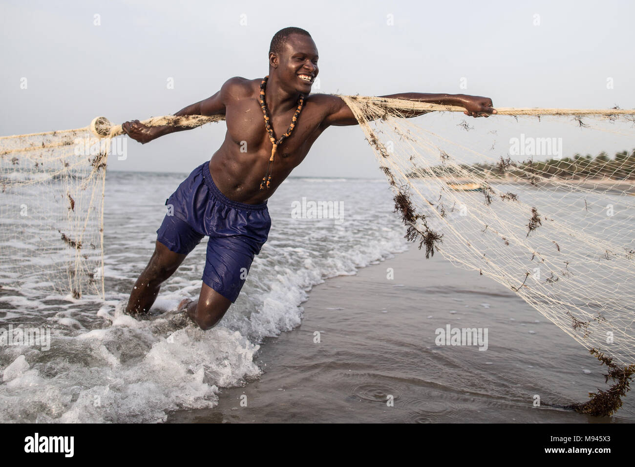 Fishermen in the costal village of Kotu, The Gambia, pull in their