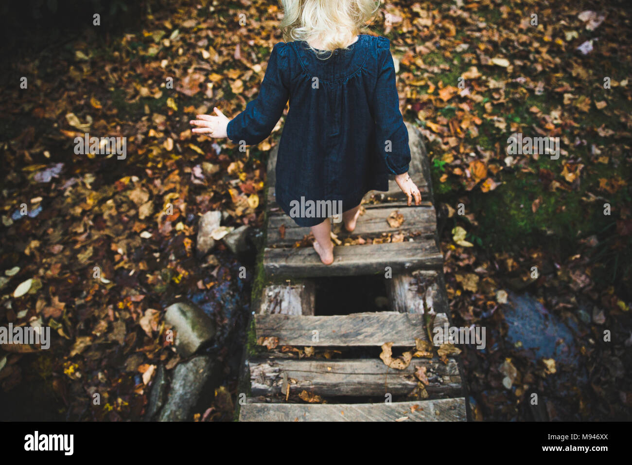 Girl crossing bridge hi-res stock photography and images - Alamy
