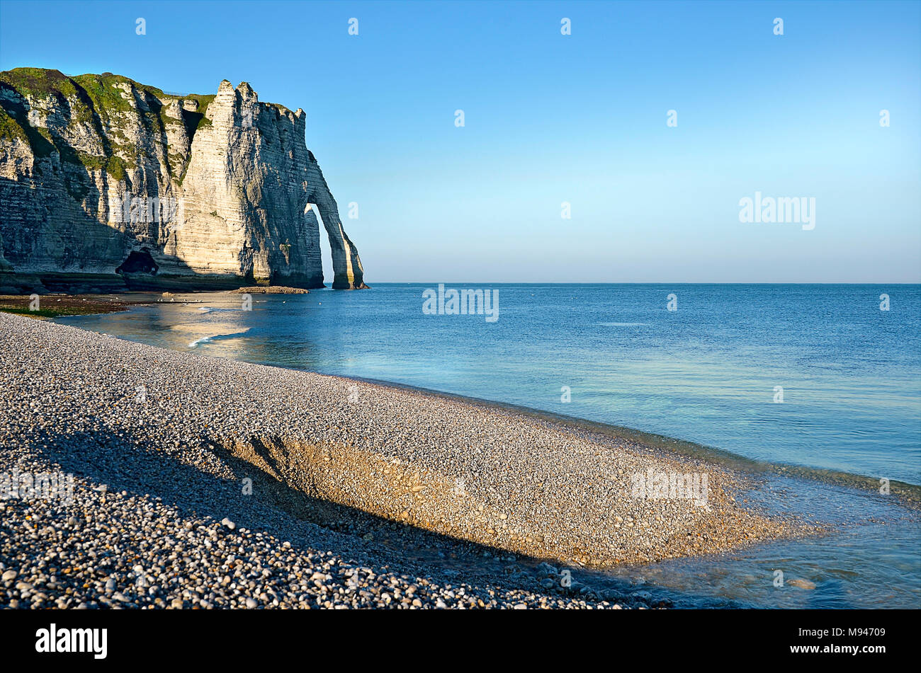 Famous pebble beach and cliff Aval of Etretat, commune in the Seine ...