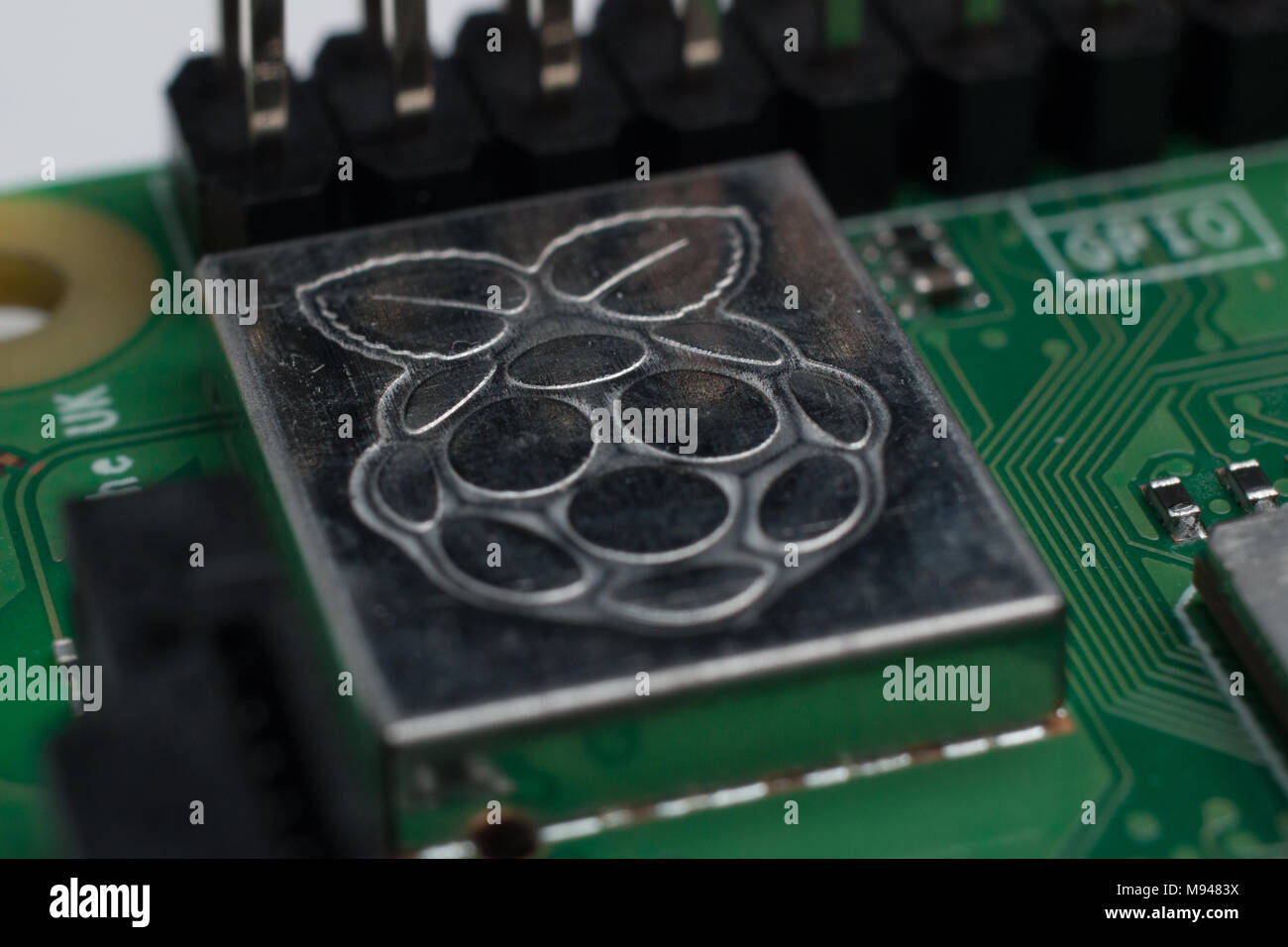 Close up of the Raspberry Pi logo etched on a Pi 3 B+ Stock Photo