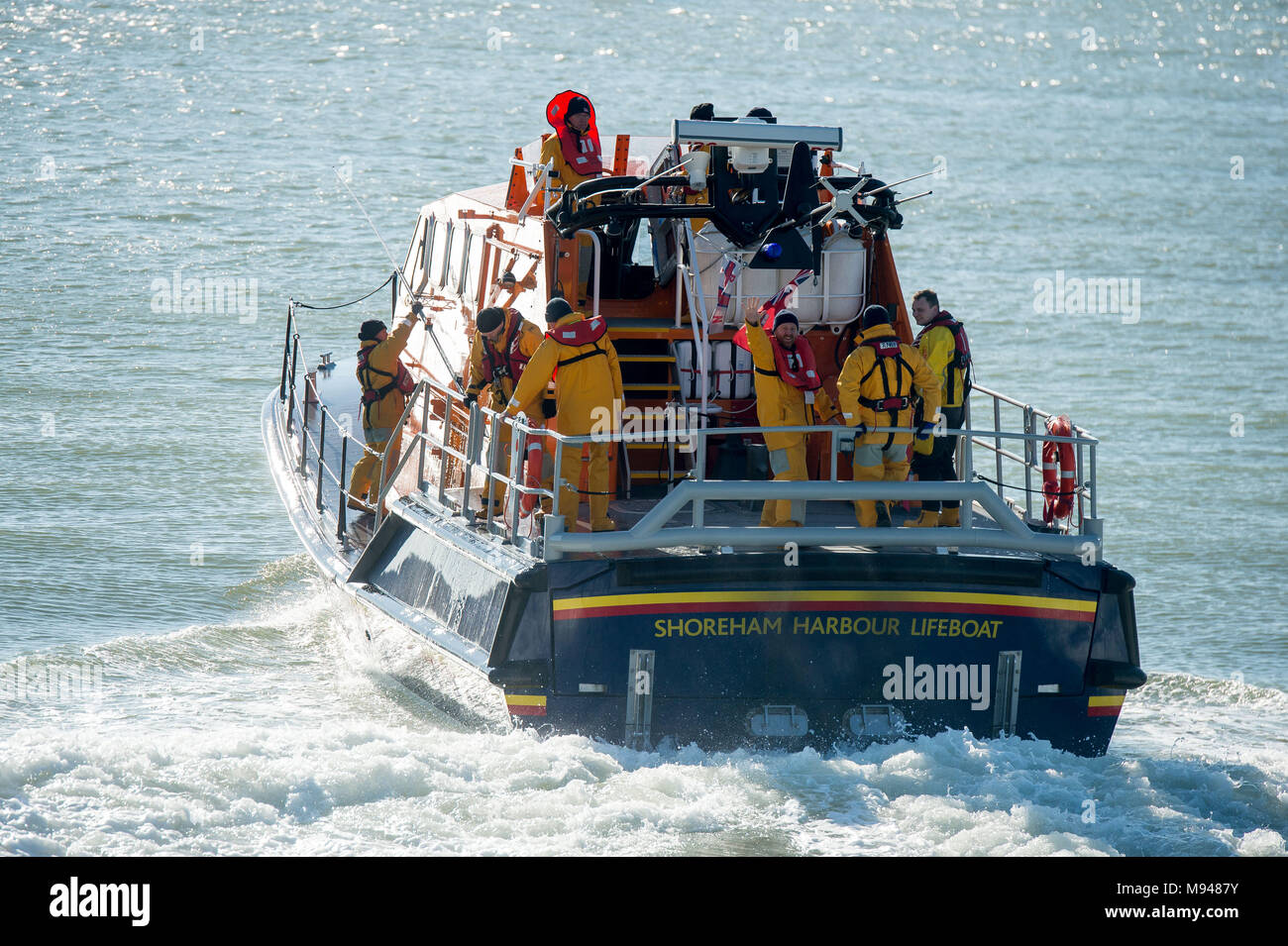 RNLI Rescue vessel launches into the sea from its base in Shoreham by Sea, Sussex, UK. Stock Photo