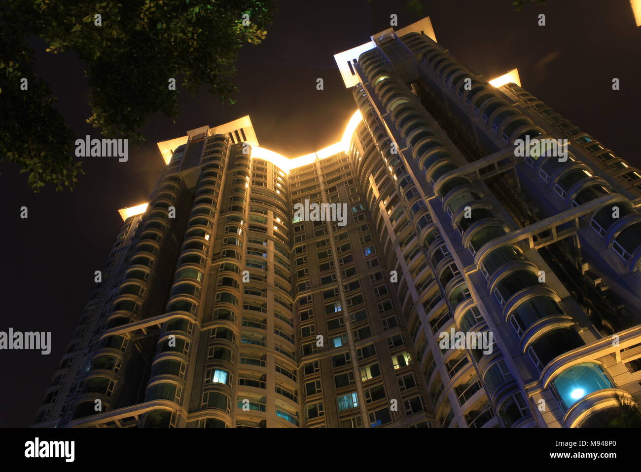 Luxury apartment build photographed at night in Guangzhou China Stock Photo