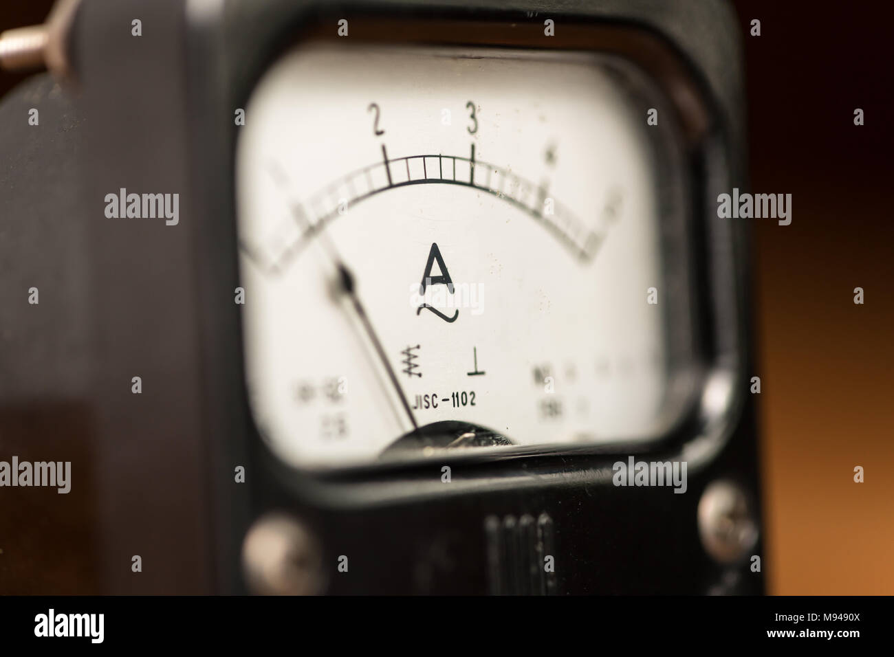Details of an old black analog ampere meter, scale and indicator Stock Photo