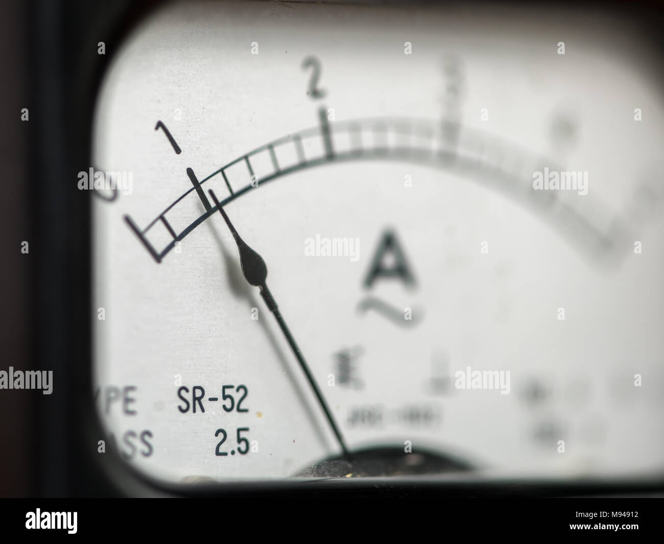 Details of an old black analog ampere meter, scale and indicator Stock Photo