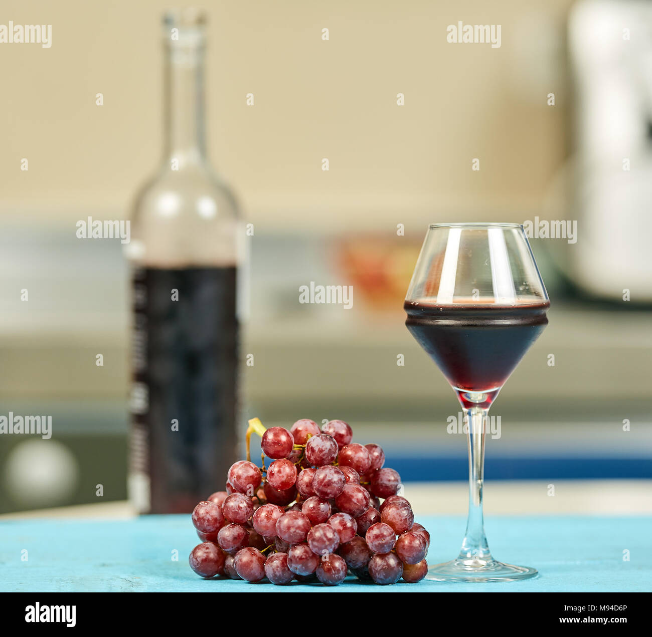 A cluster of red grapes and a glass of dry red wine Stock Photo Alamy
