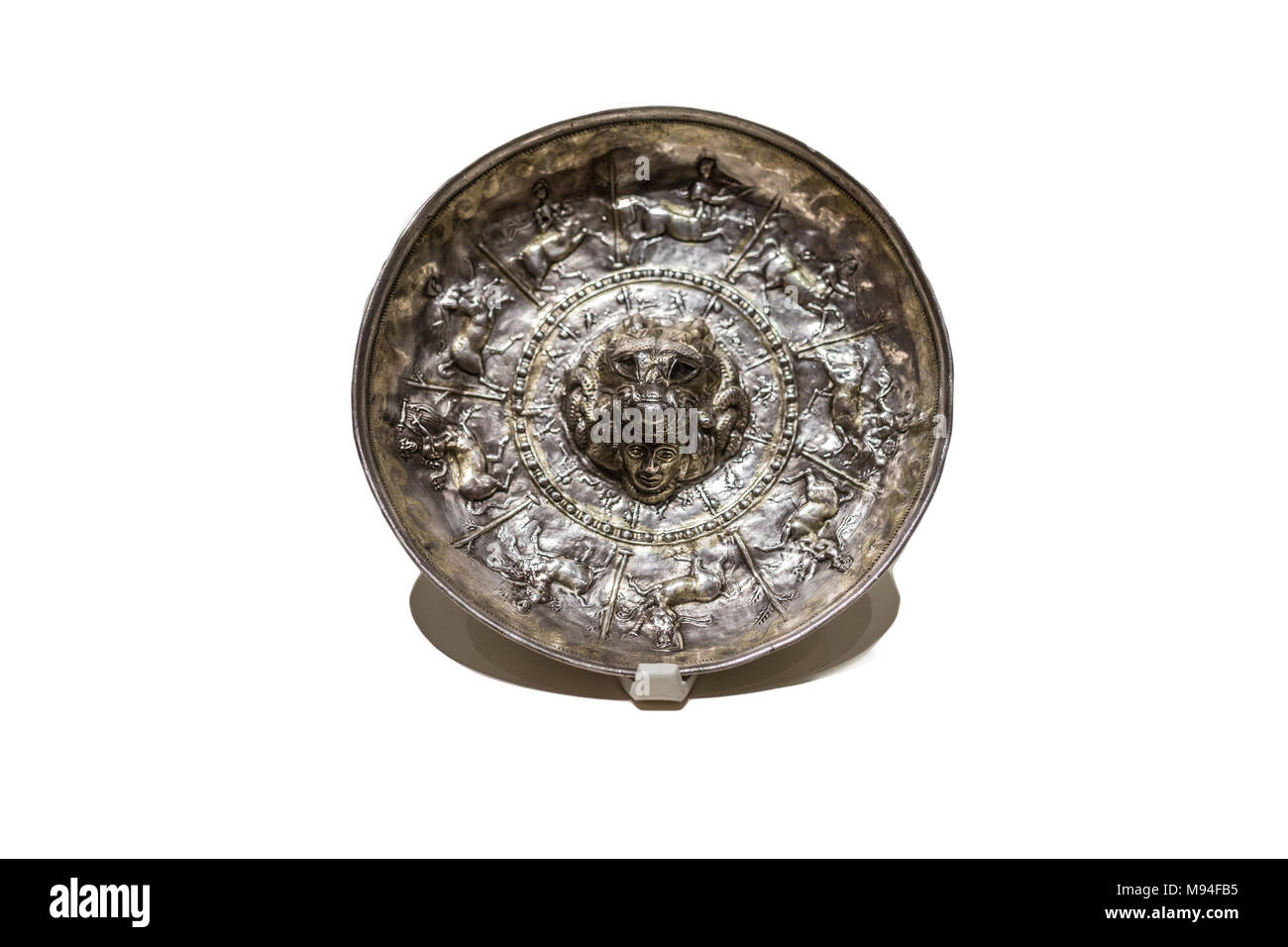 Madrid, Spain - November 10, 2017: Patera for libations from Iberian Culture made of gilded silver. National Archaeological Museum Stock Photo