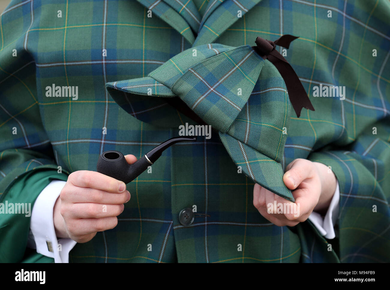 Harry Chamberlain holds a pipe and deerstalker hat at the launch in Edinburgh of the Sherlock Holmes tartan which has been designed by the great great step granddaughter of author Sir Arthur Conan Doyle, who created the fictional detective. Stock Photo