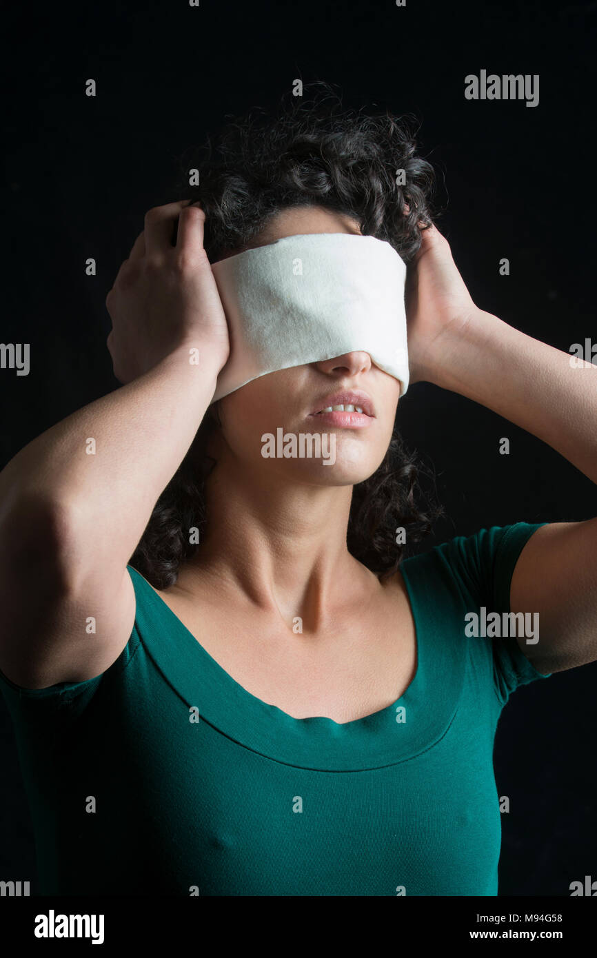 Portrait of a blindfolded woman with dark hair Stock Photo