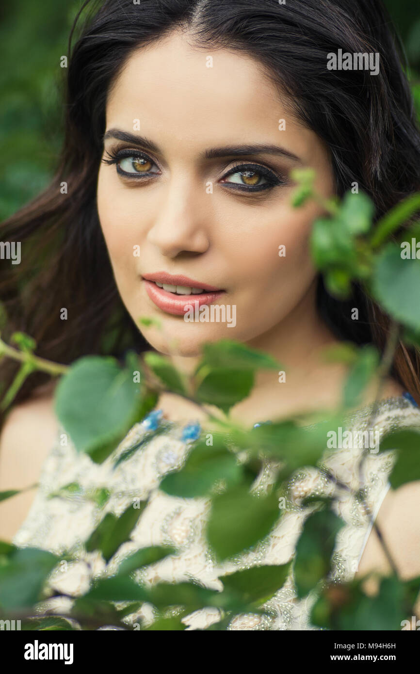Beautiful young woman smiling outdoors Stock Photo - Alamy