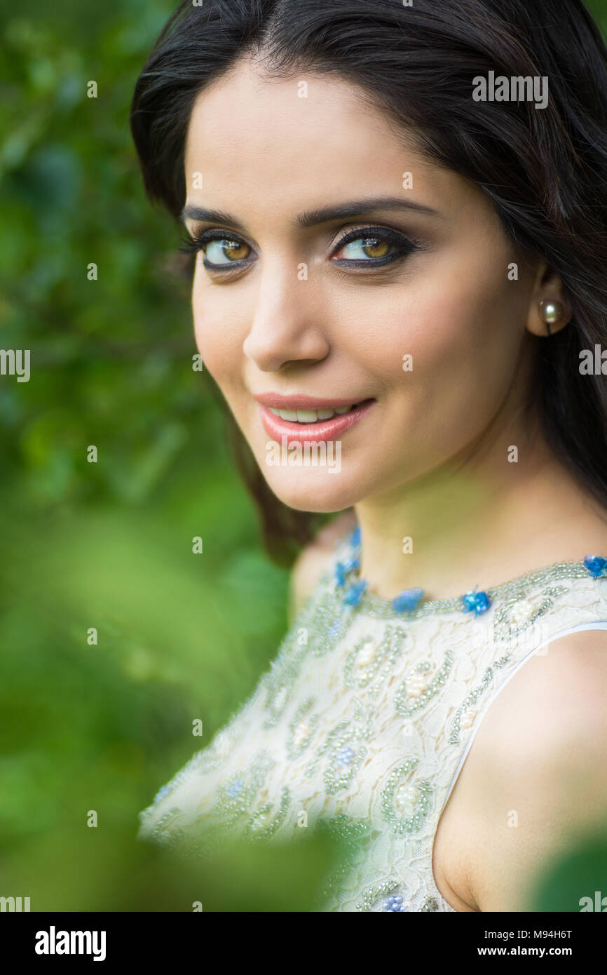 Happy young woman smiling outdoors Stock Photo