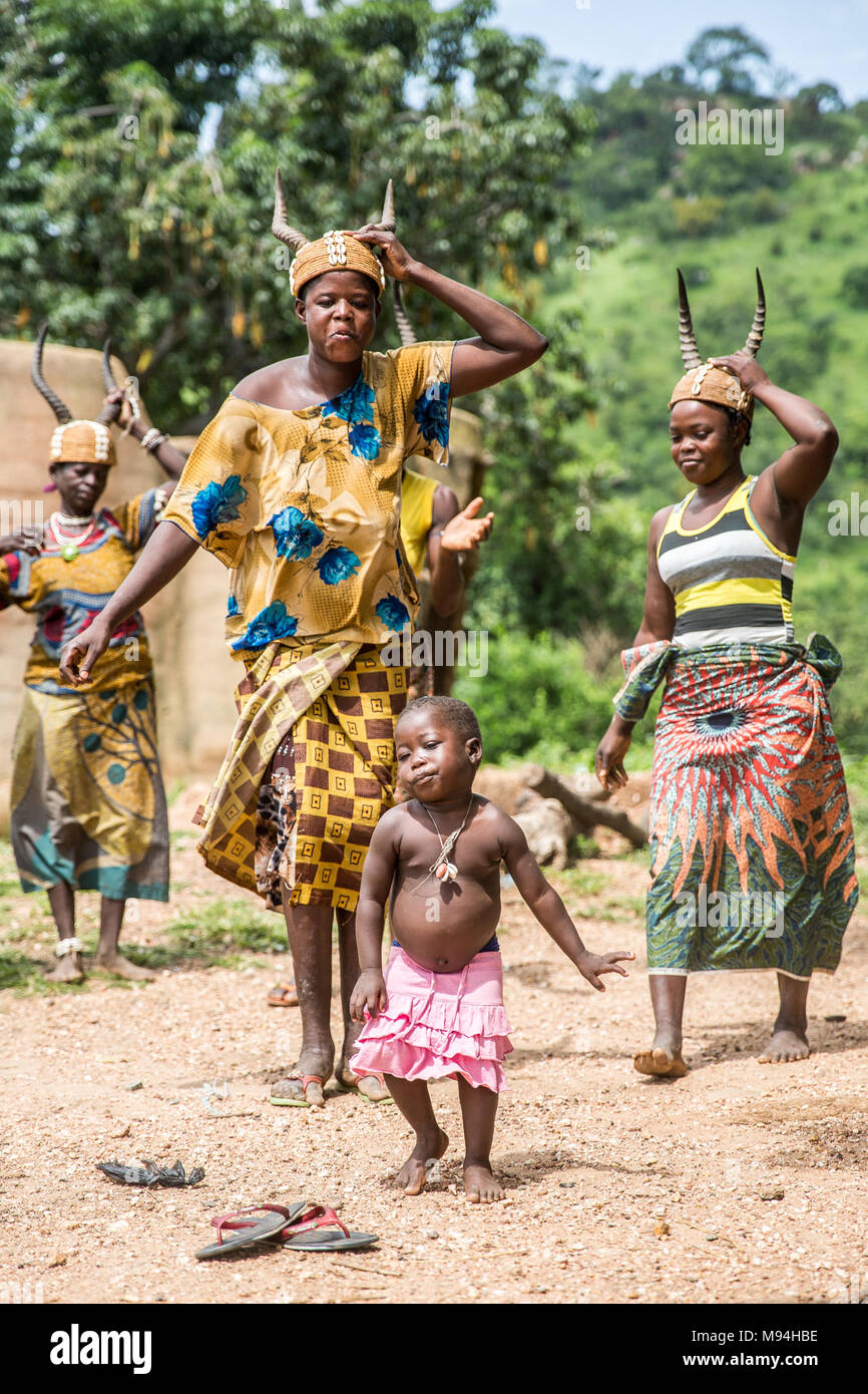 Somba village residents dance in front of their Tata Somba houses, northern Togo. Stock Photo