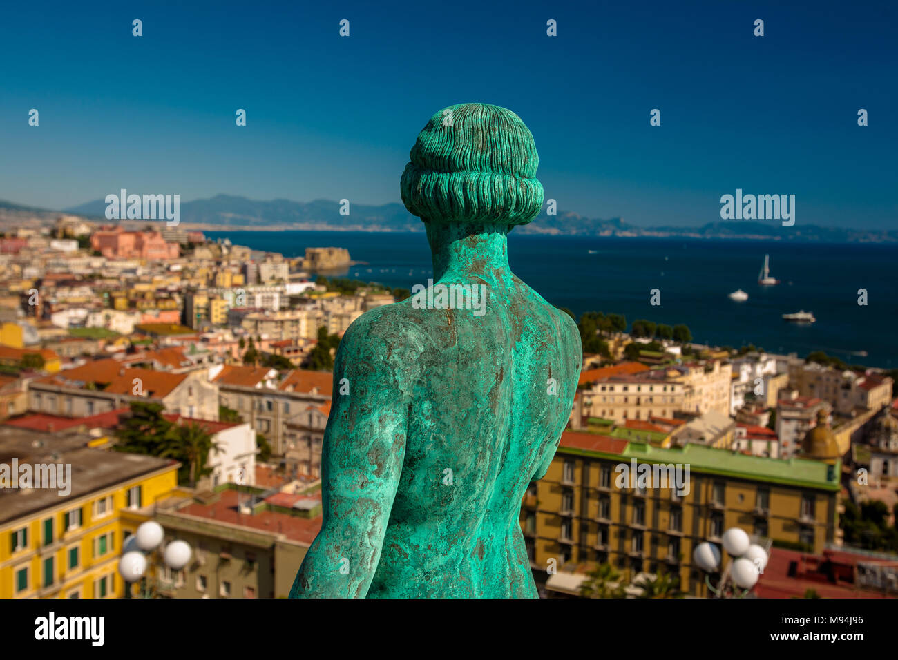 A neoclassical statue faces out towards the bay of Naples and city, Naples, Italy Stock Photo