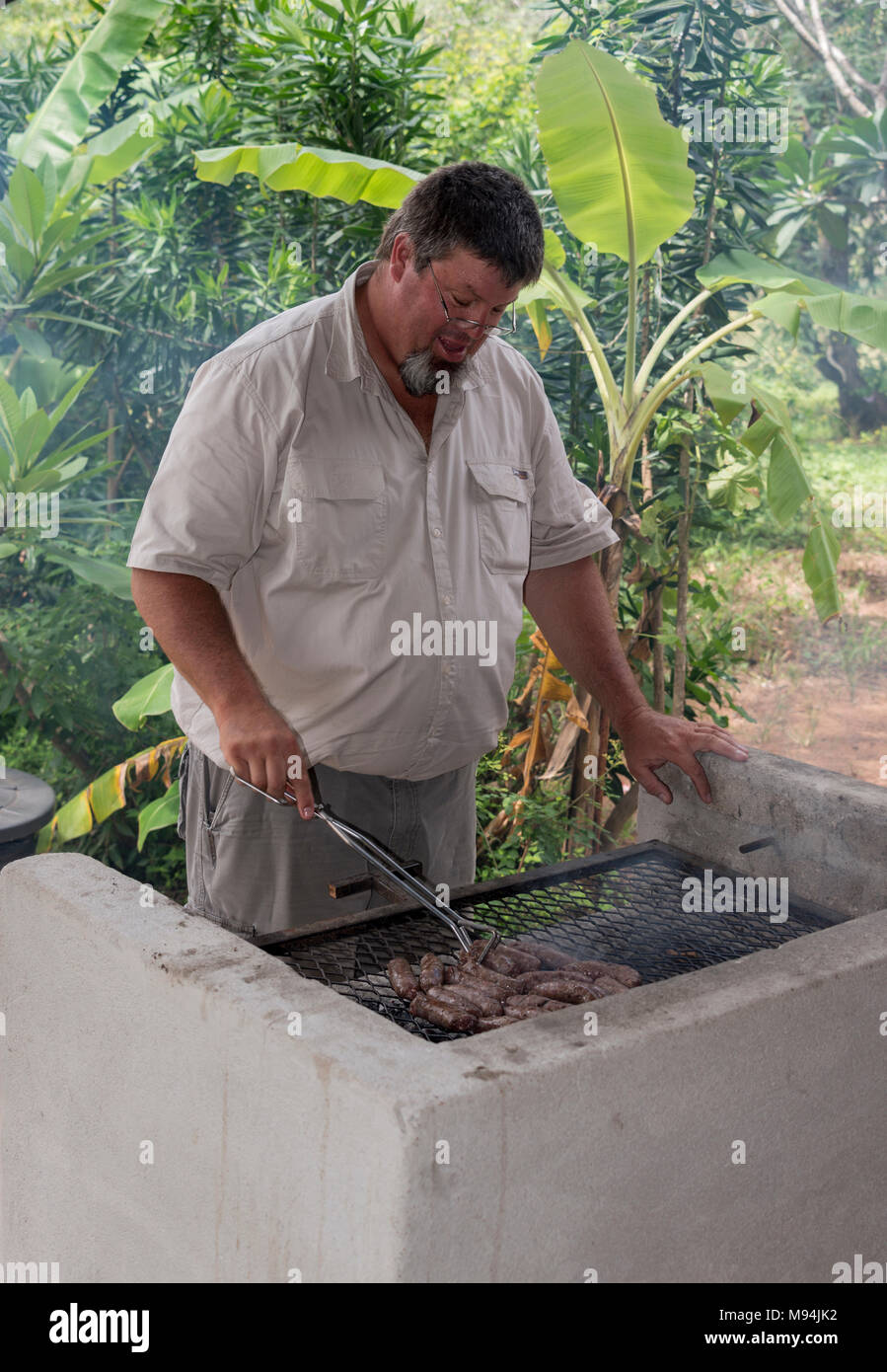 ranger making food on the bbq Stock Photo - Alamy