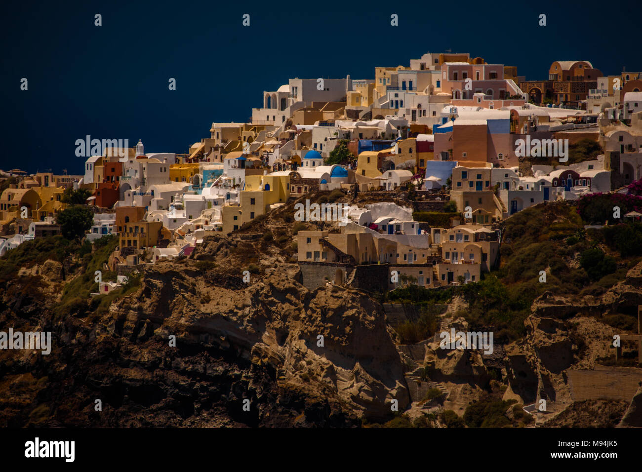 A colourful clifftop village built on the caldera edge of the Santorini´s dormant undersea volcano, Santorini, Greece. Stock Photo