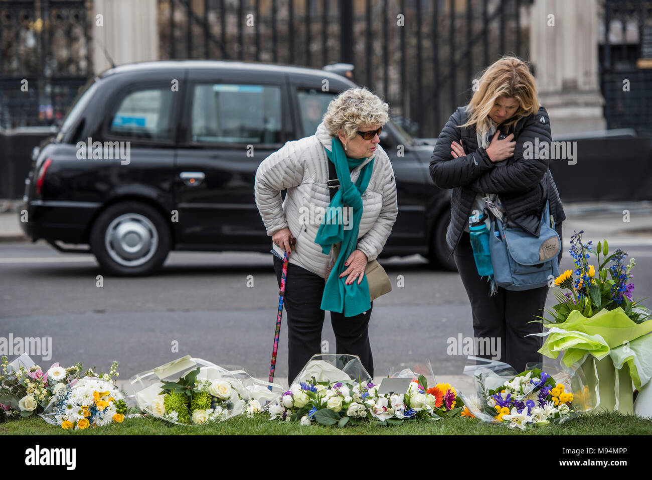 London, UK. 22nd March, 2018. On the first anniversary of the Westminster Bridge attack, floral tributes are left on Parliament Square. Credit: Guy Bell/Alamy Live News Stock Photo