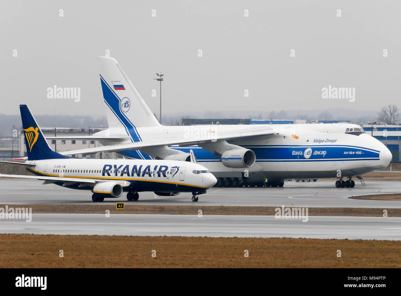 Gdansk, Poland. 22nd Mar, 2018. Russian strategic airlift jet aircraft Antonov An-124-100 Ruslan owned by Volga-Dnepr Airlines and low cost airline Ryanair aircraft Boeing 737-800 in Gdansk Lech Walesa Airport in Gdansk, Poland. March 22nd 2018 © Wojciech Strozyk / Alamy Live News Stock Photo