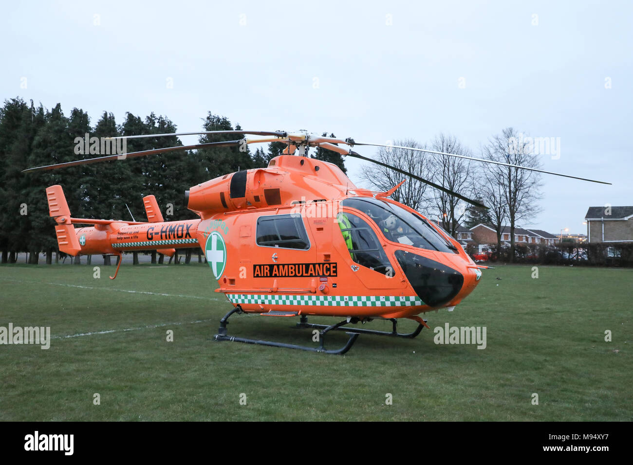 Luton, UK. 22nd Mar, 2018. Paramedics respond to an emergency call in Luton, Bedfordshire and land their MD-900 Air Ambulance helicopter at Crawley Green Park. Credit: Nick Whittle/Alamy Live News Stock Photo