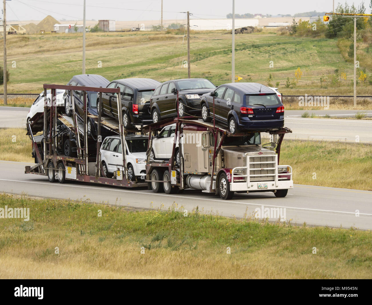 Gull Lake, Saskatchewan, Canada. 13th Sep, 2017. A semi-trailer car carrier transport truck with a load of Dodge automobiles travels along the Trans Canada Highway near Gull Lake, Saskatchewan, Canada. Credit: Bayne Stanley/ZUMA Wire/Alamy Live News Stock Photo