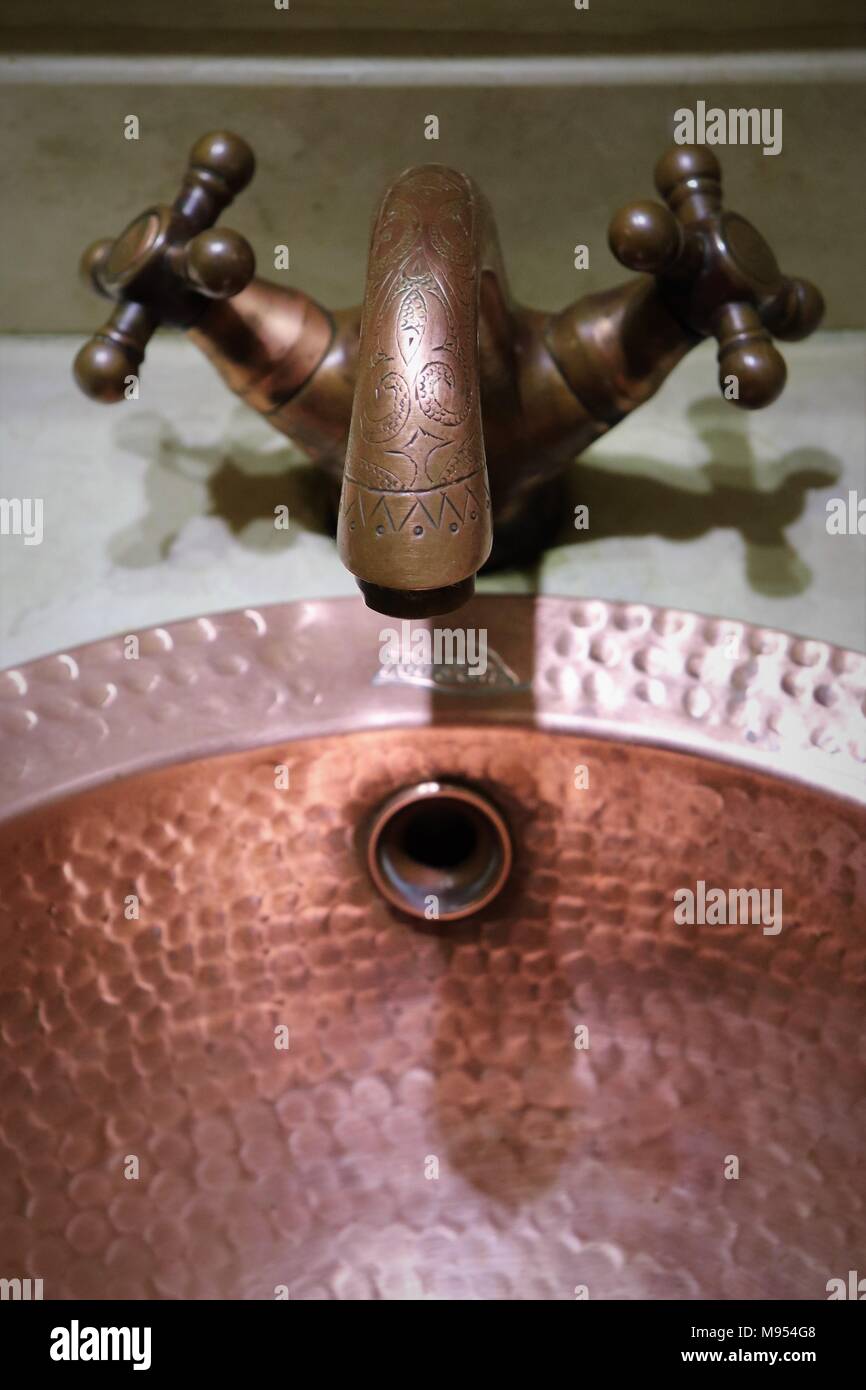 Detail of a decorative tap and basin in a Riad Morocco Stock Photo
