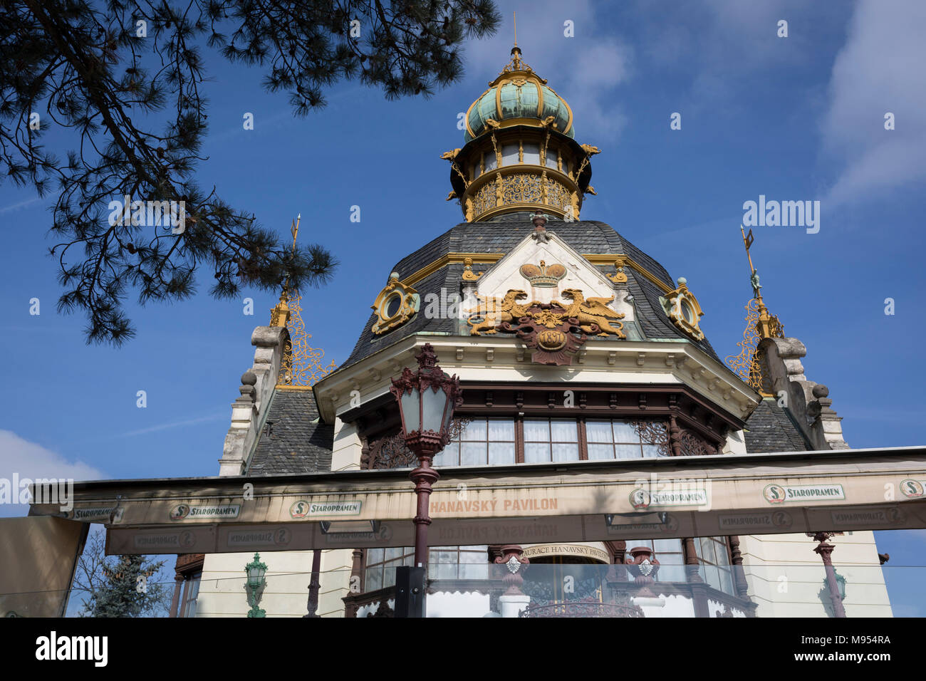 An exterior of the Hanavsky Pavilion in Letna Park, on 19th March, 2018, in Prague, the Czech Republic. Hanavsky Pavilion was originally built as the representative pavilion of the Komárov Ironworks for the Prague Jubilee Exhibition in 1891. It was the first cast iron structure in Prague, and today it’s a luxury restaurant with one of the most beautiful panoramic views of the Prague bridges. Stock Photo