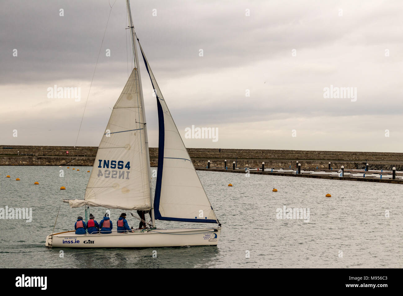 A small boat sailing in Dun Laoghaire Harbour , Dublin, Ireland Stock Photo Alamy