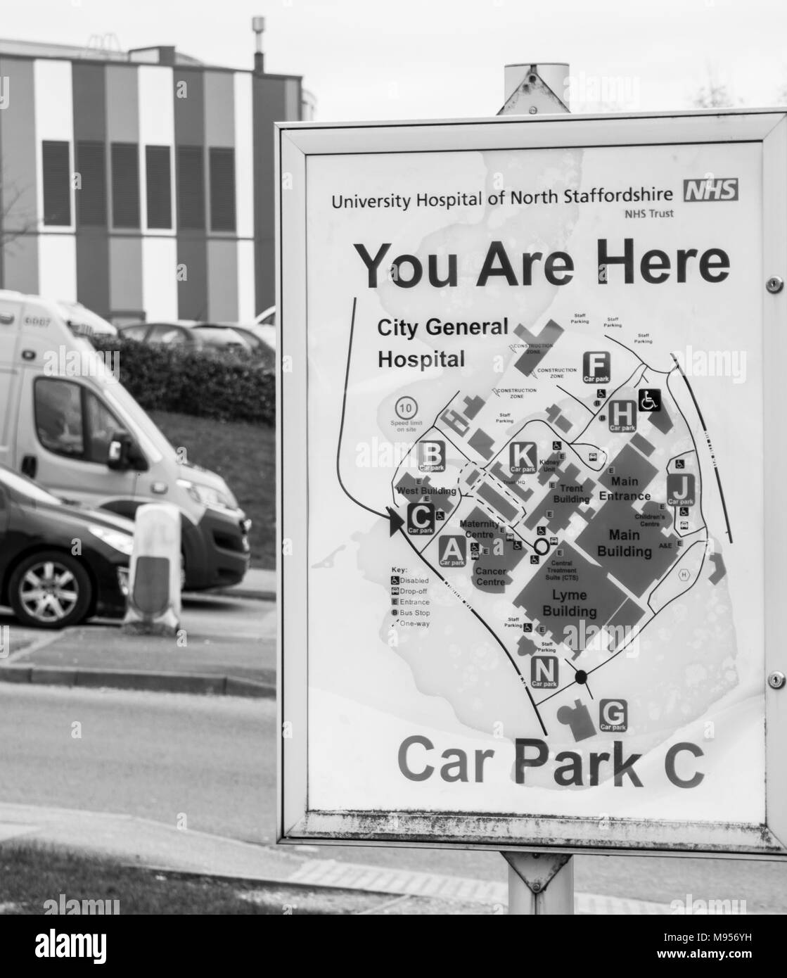 Royal Stoke Hospital You Are Here sign with ambulance and buildings in the background Stock Photo