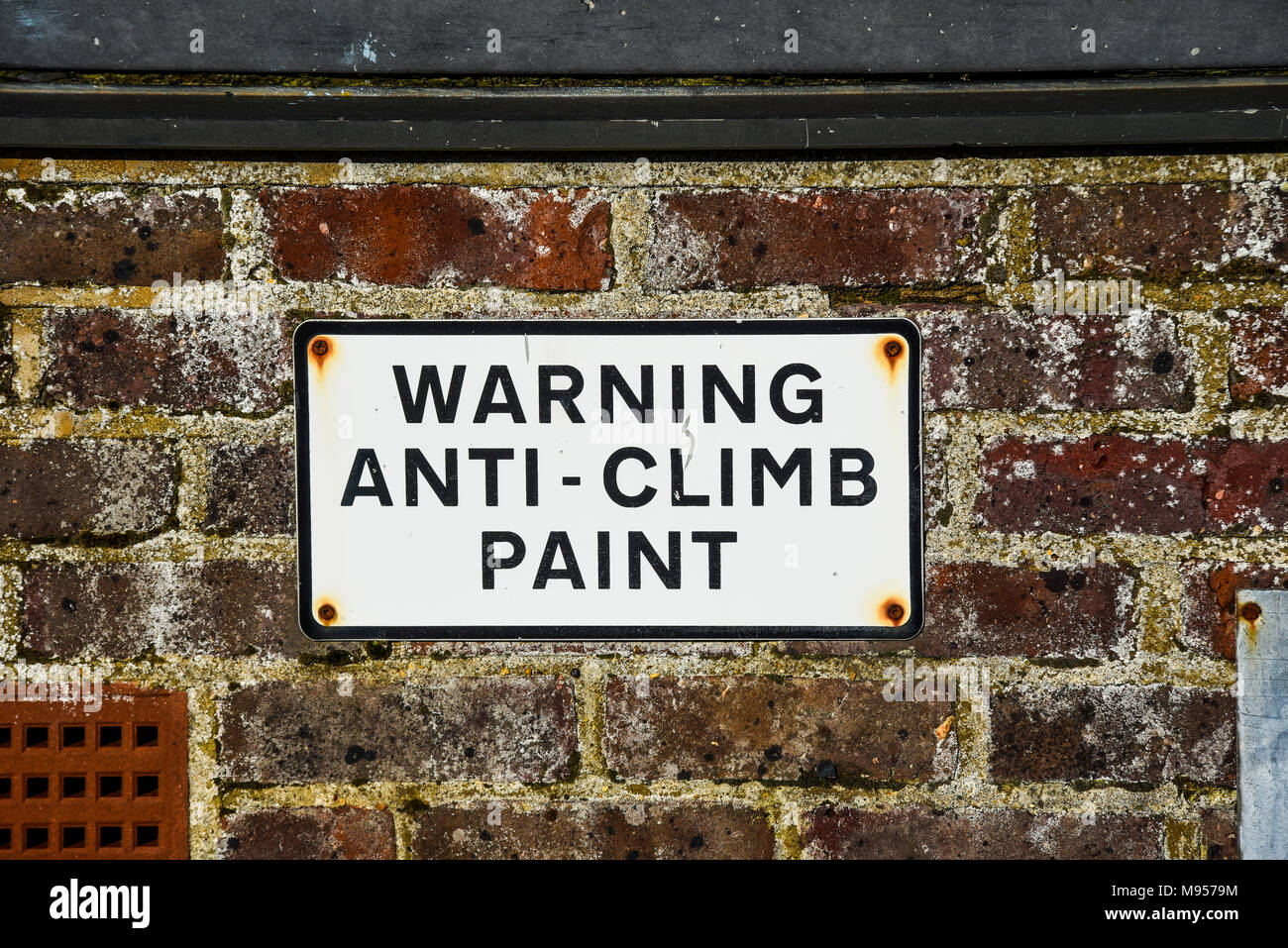Warning anti climb paint sign on wall. Space for copy Stock Photo Alamy