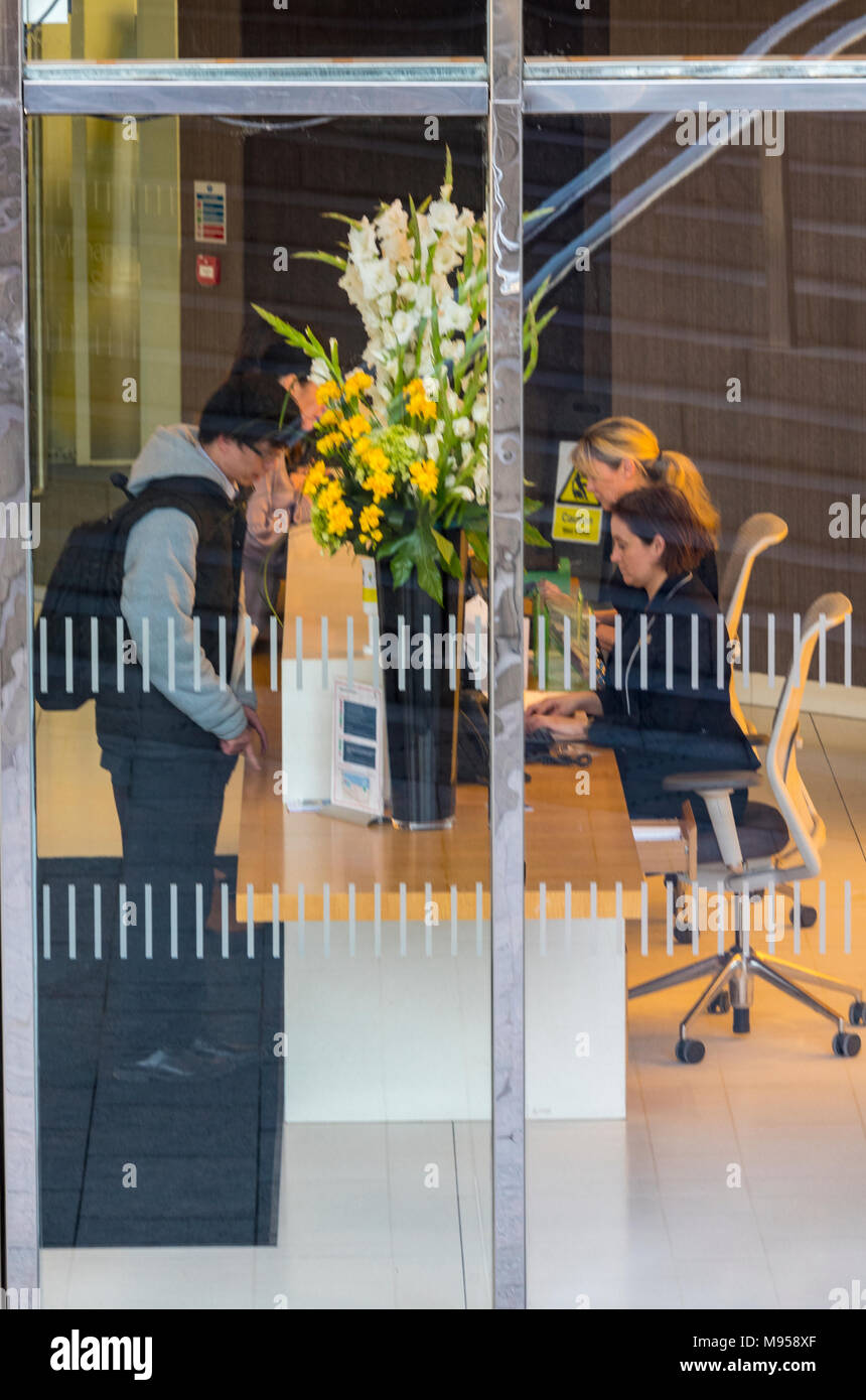 the reception desk at a large corporate office building in central