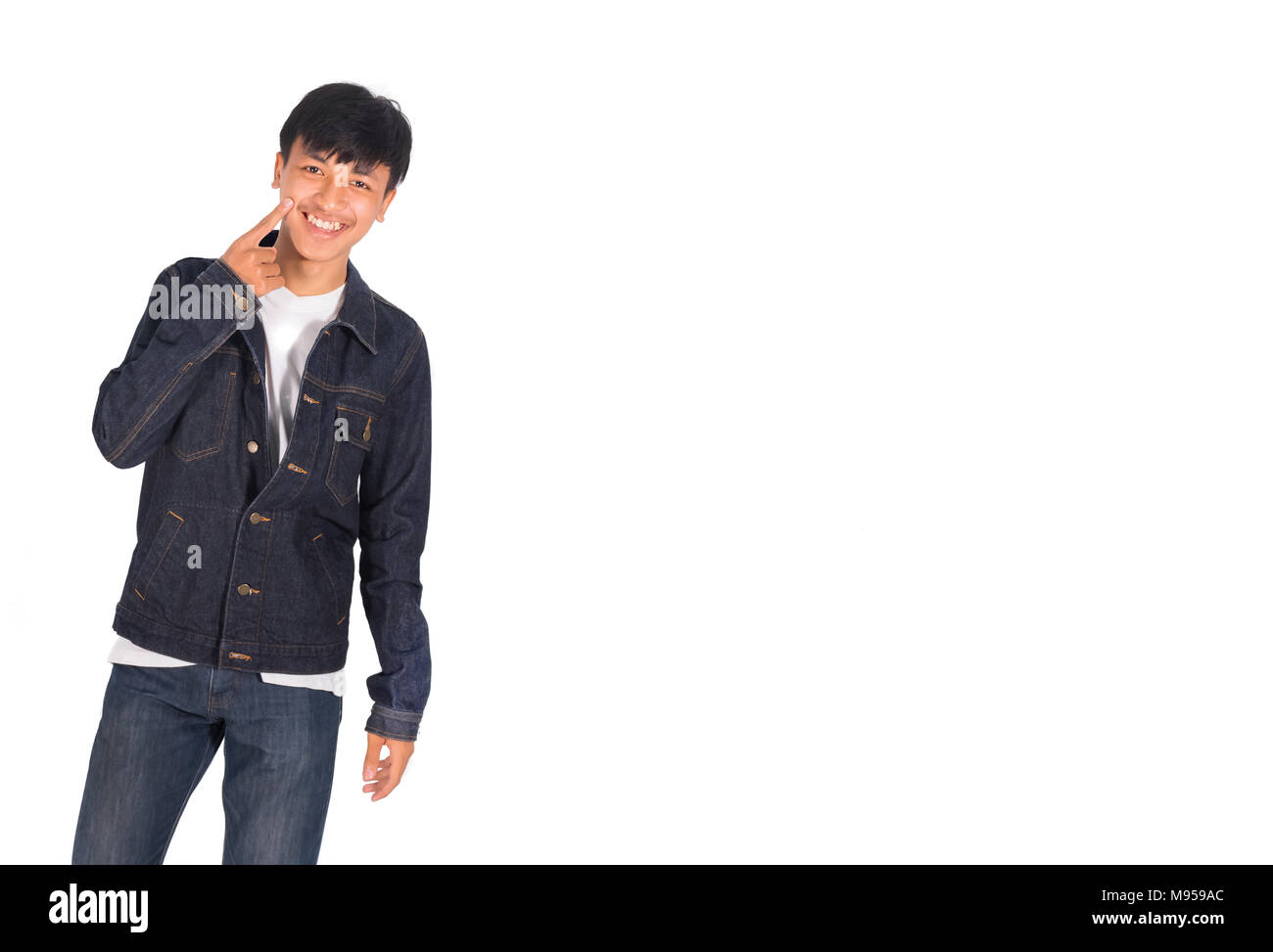 The Portrait Photo Of An Asian Man In Dark Blue Jeans Jacket And White Shirt Isolated Stock Photo Alamy