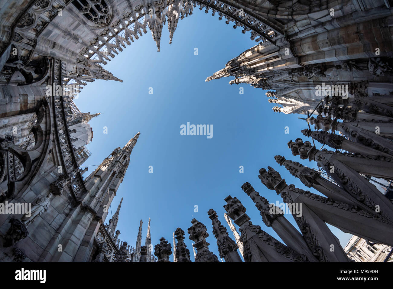 Skywards view to the ornate towers of the Duomo Cathedral in Milan, Italy Stock Photo