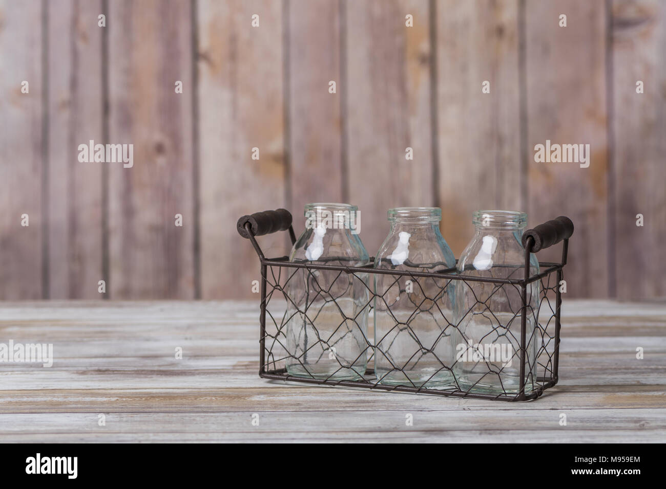 Vintage milk bottles in a wire basket carrier Stock Photo Alamy