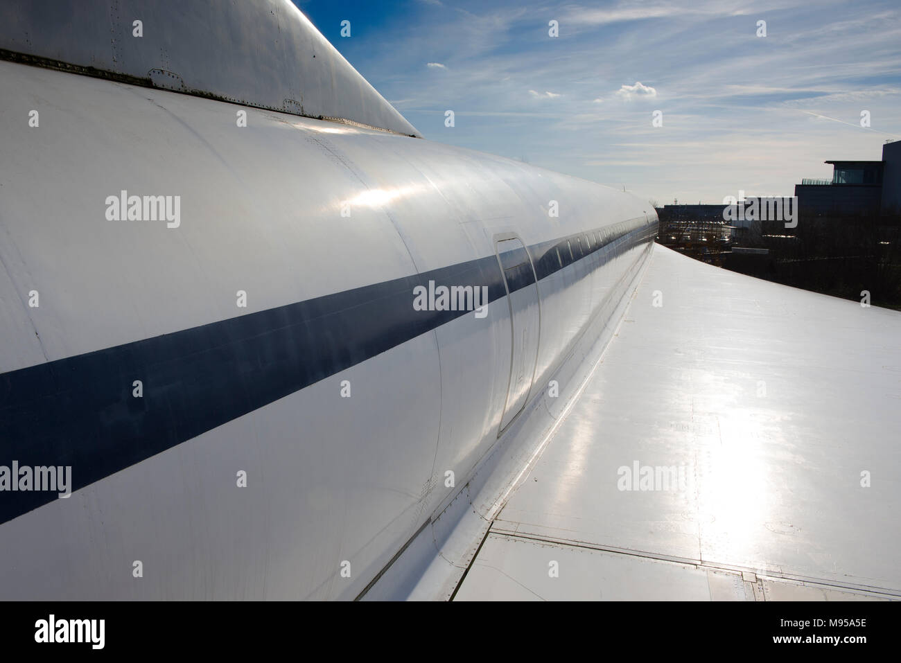 A view along the starboard fuselage and wing of Concorde at Brooklands Museum, Weybridge, Surrey, England Stock Photo