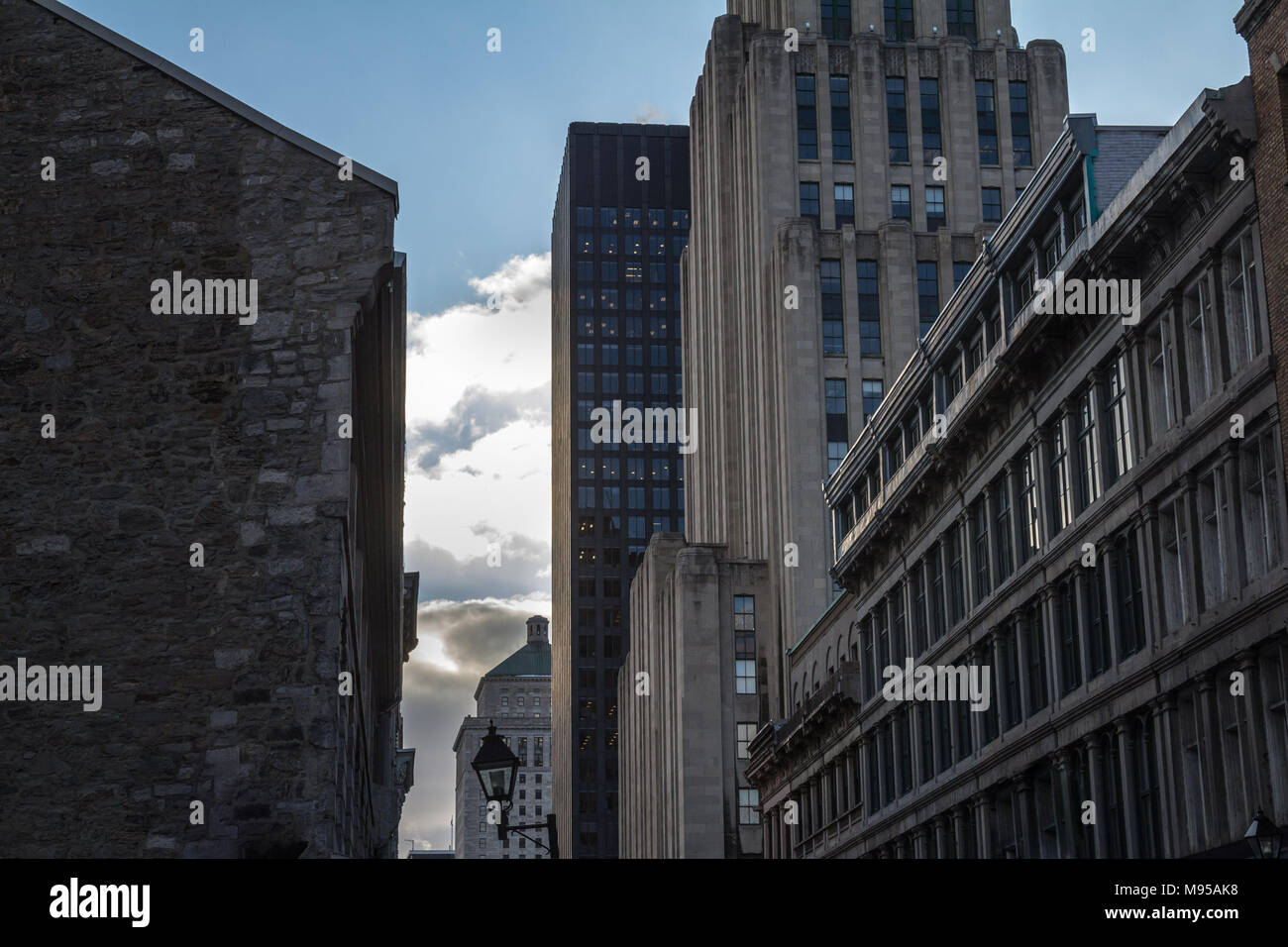 Skyscrapers and older buildings in Old Montreal (Vieux Montreal), Quebec, Canada. Old Montreal is one of the oldest parts of North America, and a majo Stock Photo