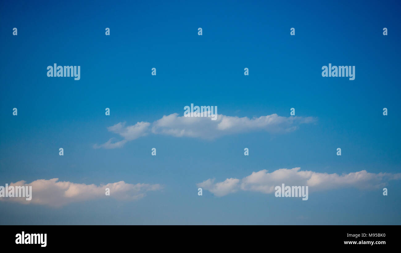 Beautiful blue sky with puffy white clouds Stock Photo - Alamy