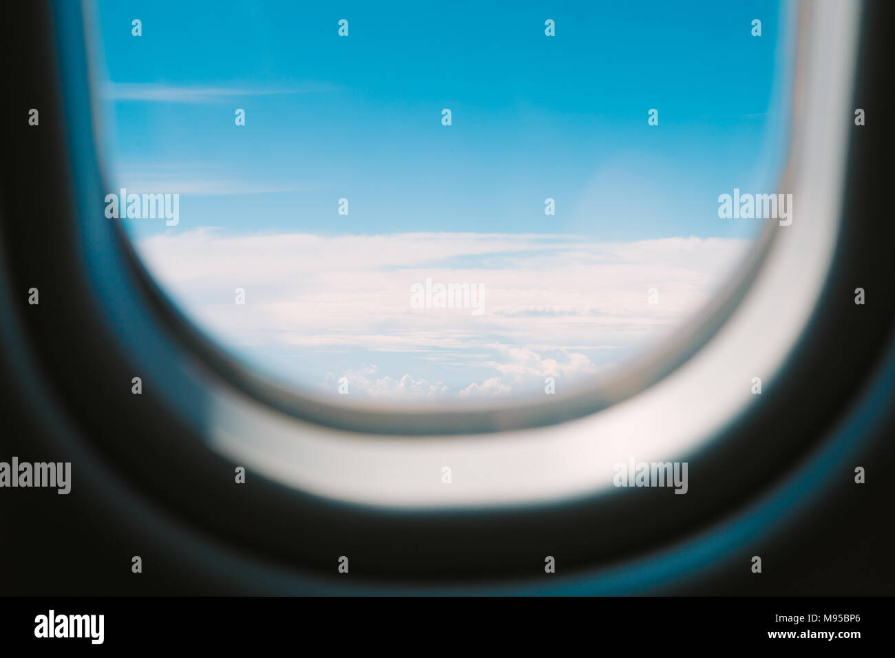 View of cloud and sky from window of airplane Stock Photo - Alamy
