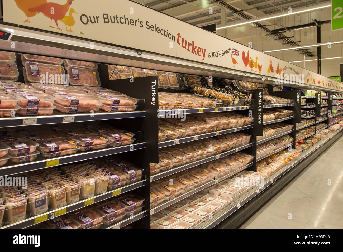 Refrigerators full of fresh chicken and turkey in an Asda supermarket