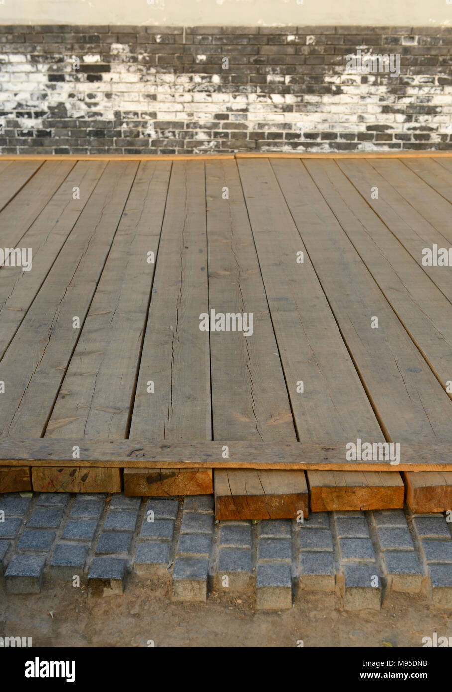 Temporary Wooden Path Covers An Unfinished Stone Path Near Kuanjie