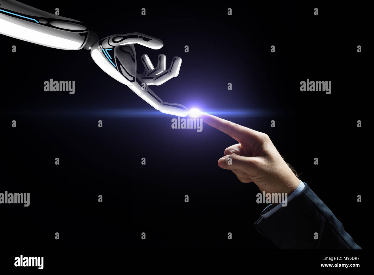 robot and human hand connecting fingers Stock Photo