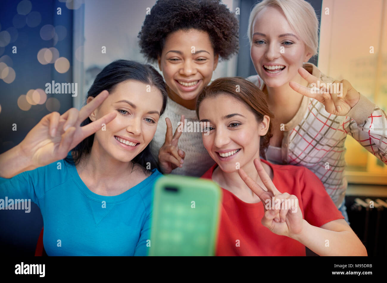 happy young women taking selfie with smartphone Stock Photo - Alamy