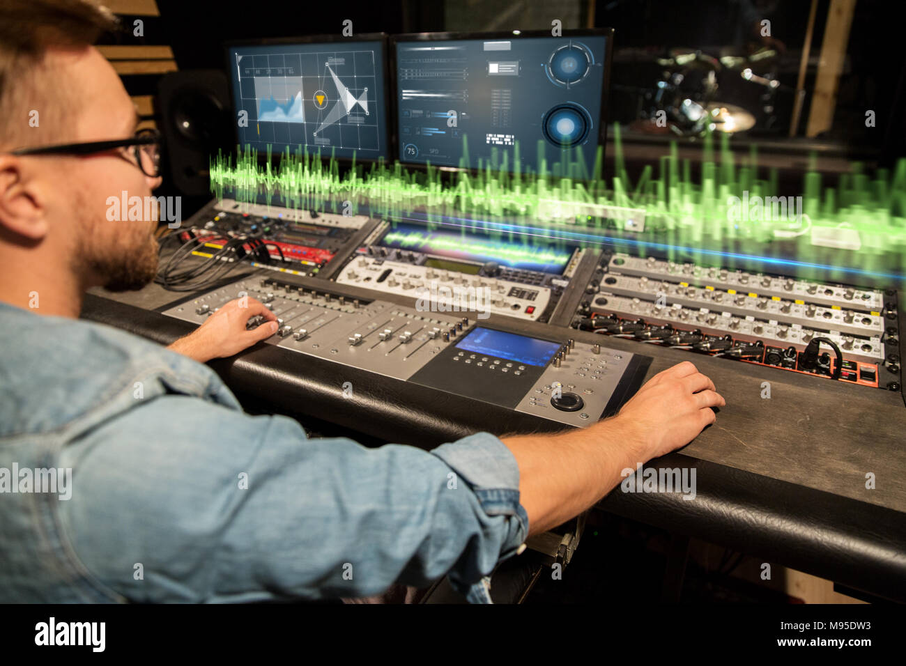 man at mixing console in music recording studio Stock Photo - Alamy