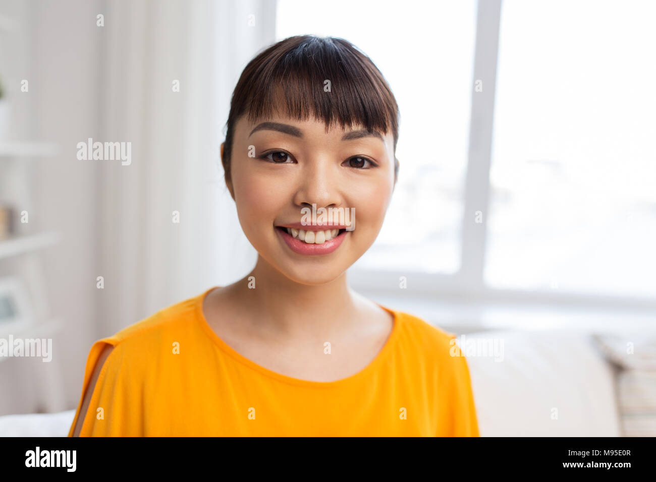 Young japanese woman smiling hi-res stock photography and images - Alamy
