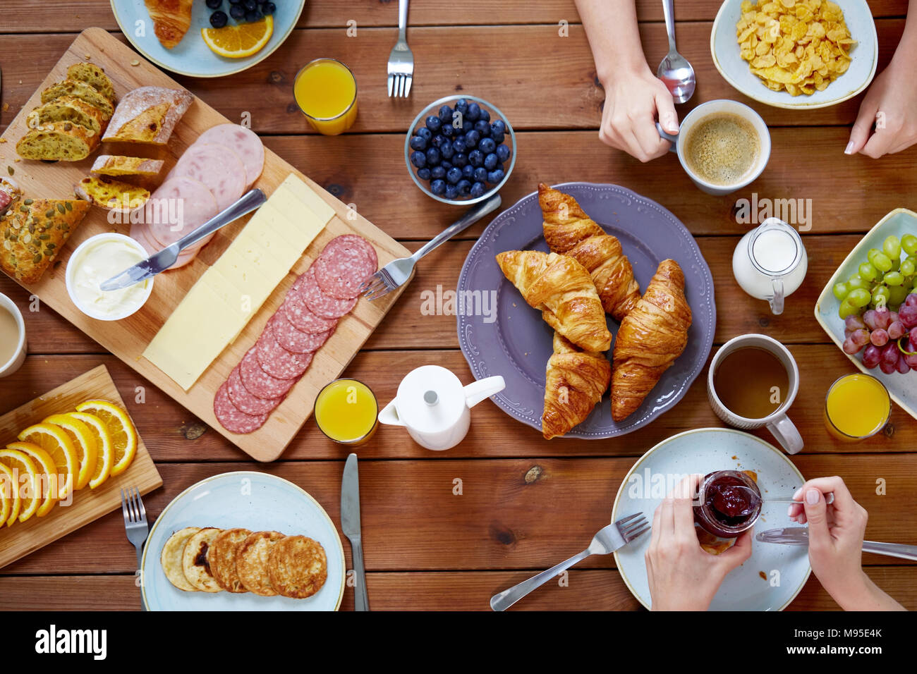 group of people having breakfast at table Stock Photo Alamy