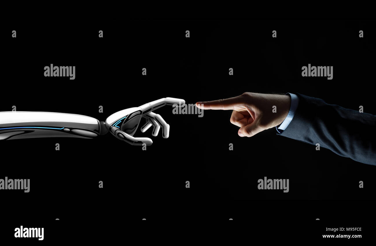 robot and human hand connecting fingers Stock Photo