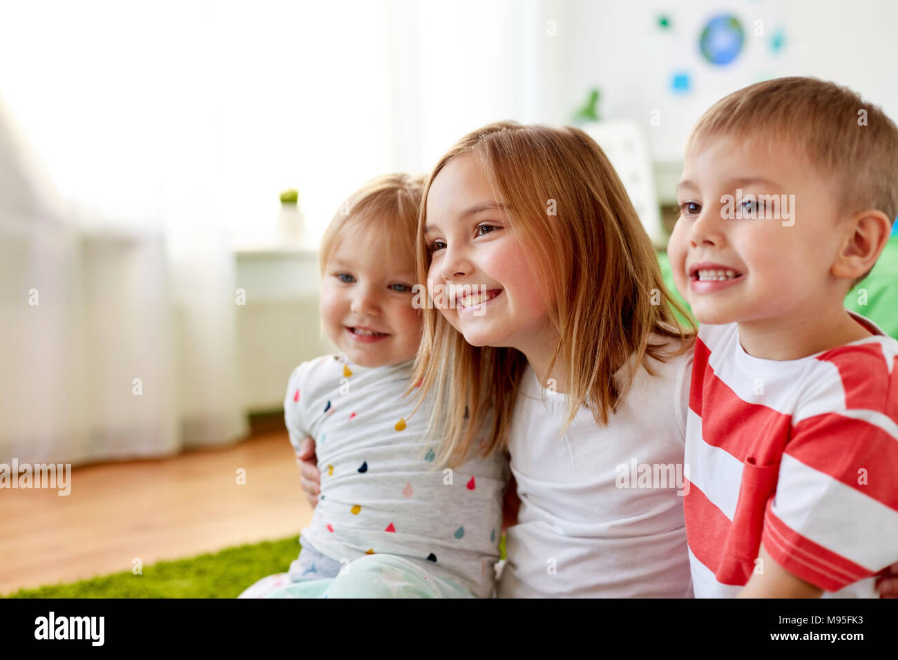 happy little kids hugging at home Stock Photo - Alamy