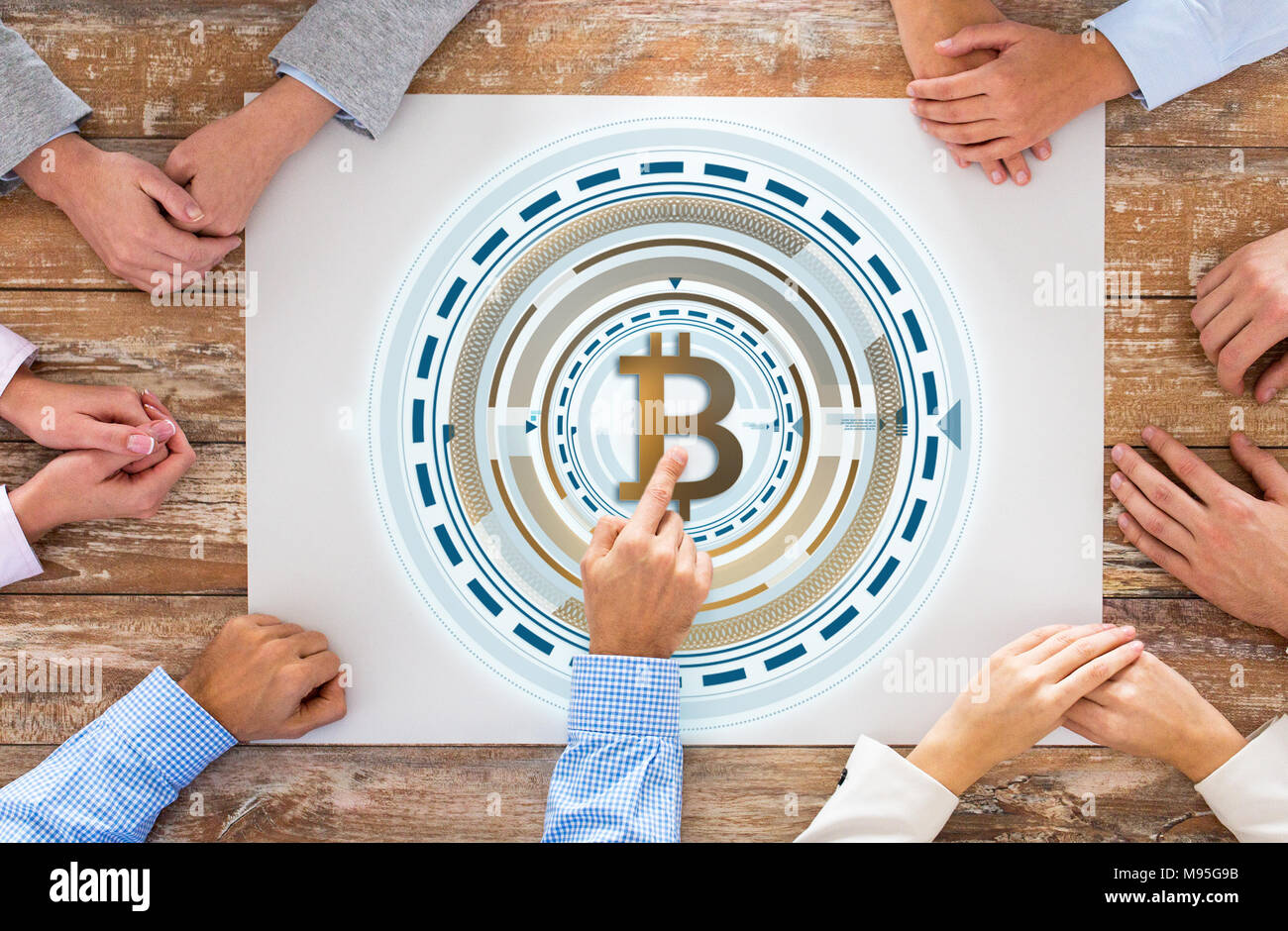 close up of business team hands with bitcoin Stock Photo