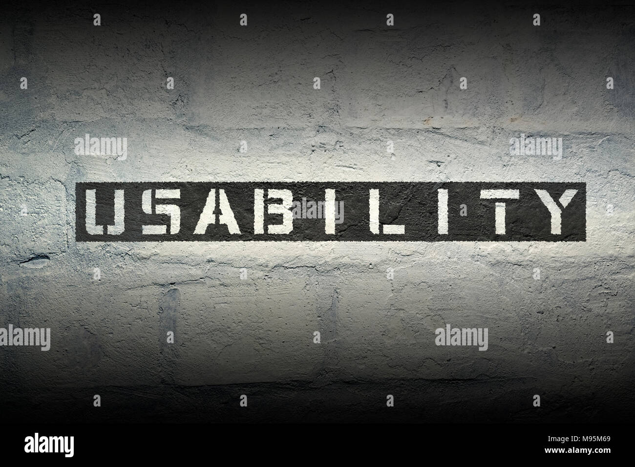 usability stencil print on the grunge white brick wall Stock Photo