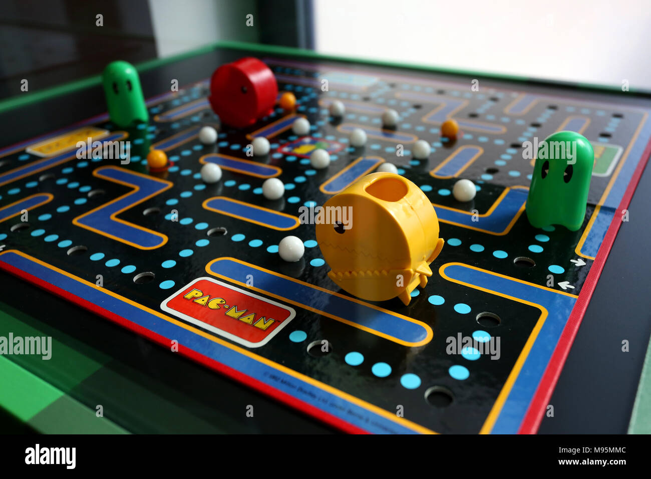 An old Pac Man Board Game pictured on display in Chichester, West Sussex, UK. Stock Photo