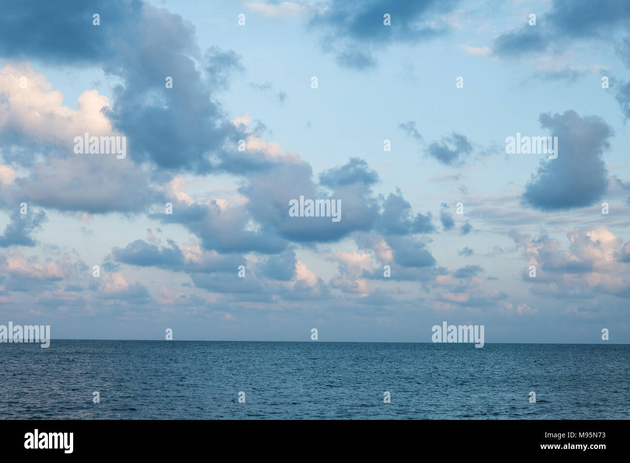 beautiful sky over ocean - colorful cloudscape over water Stock Photo