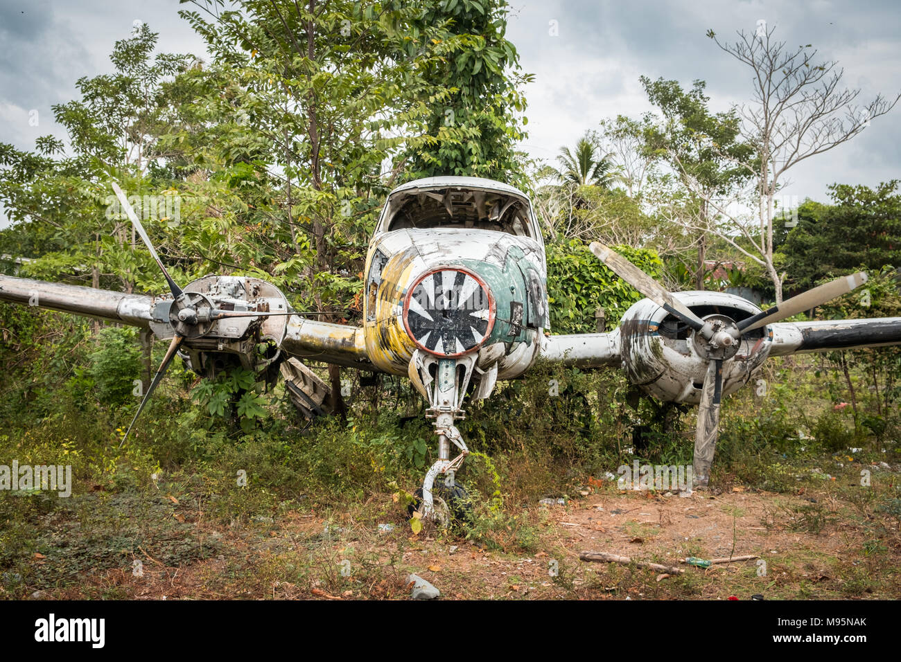 aircraft  wreck  in jungle - old propeller  airplane  in forest - Stock Photo