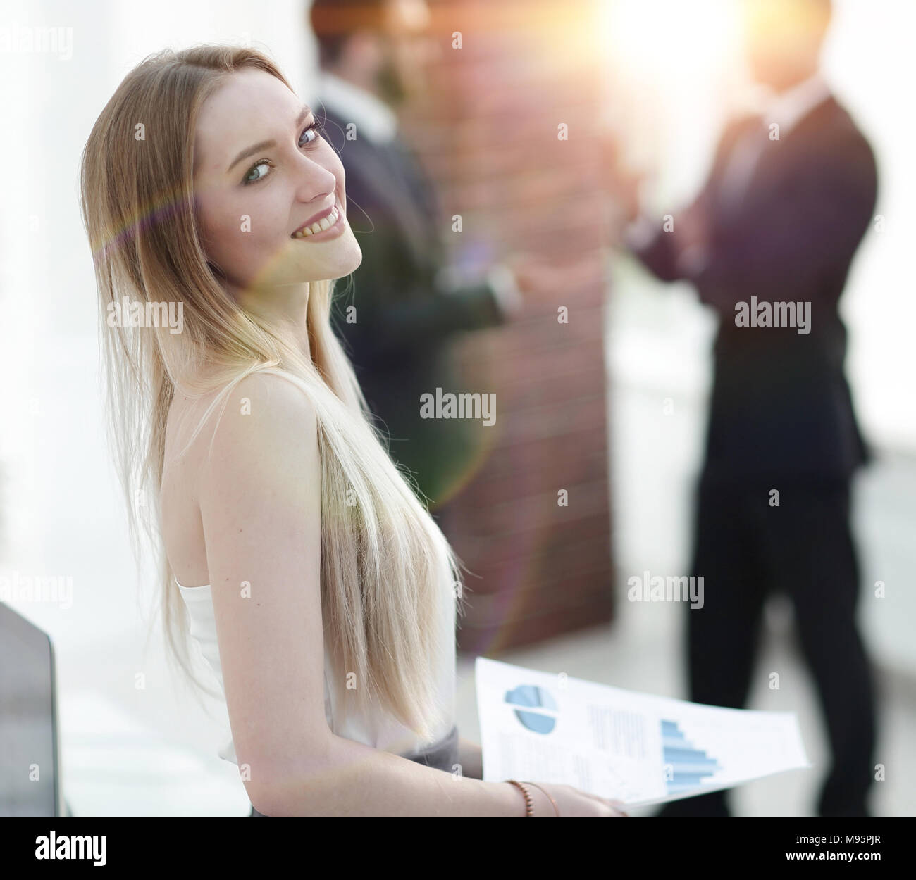portrait of an elegant young business woman on the office background ...